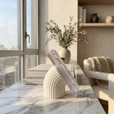 Phantom Display concrete base stand close-up lifestyle shot showing architectural ribbed design