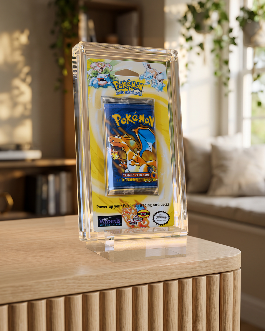 Phantom Blister Pack Display, a sealed vintage Pokemon booster blister in a crystal acrylic display on a clear base, on an oak sideboard