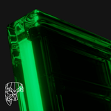 Close-up of a Phantom Display ghost-themed, glow-in-the-dark graded card display case, highlighting the sleek edges and green glow for high-end card protection and display.