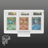 25th Anniversary Edition Pokémon cards (Venusaur, Charizard, Blastoise) in a premium Phantom Display, featuring Beckett grading for pristine protection and eye-catching presentation. #authenticator_bgs