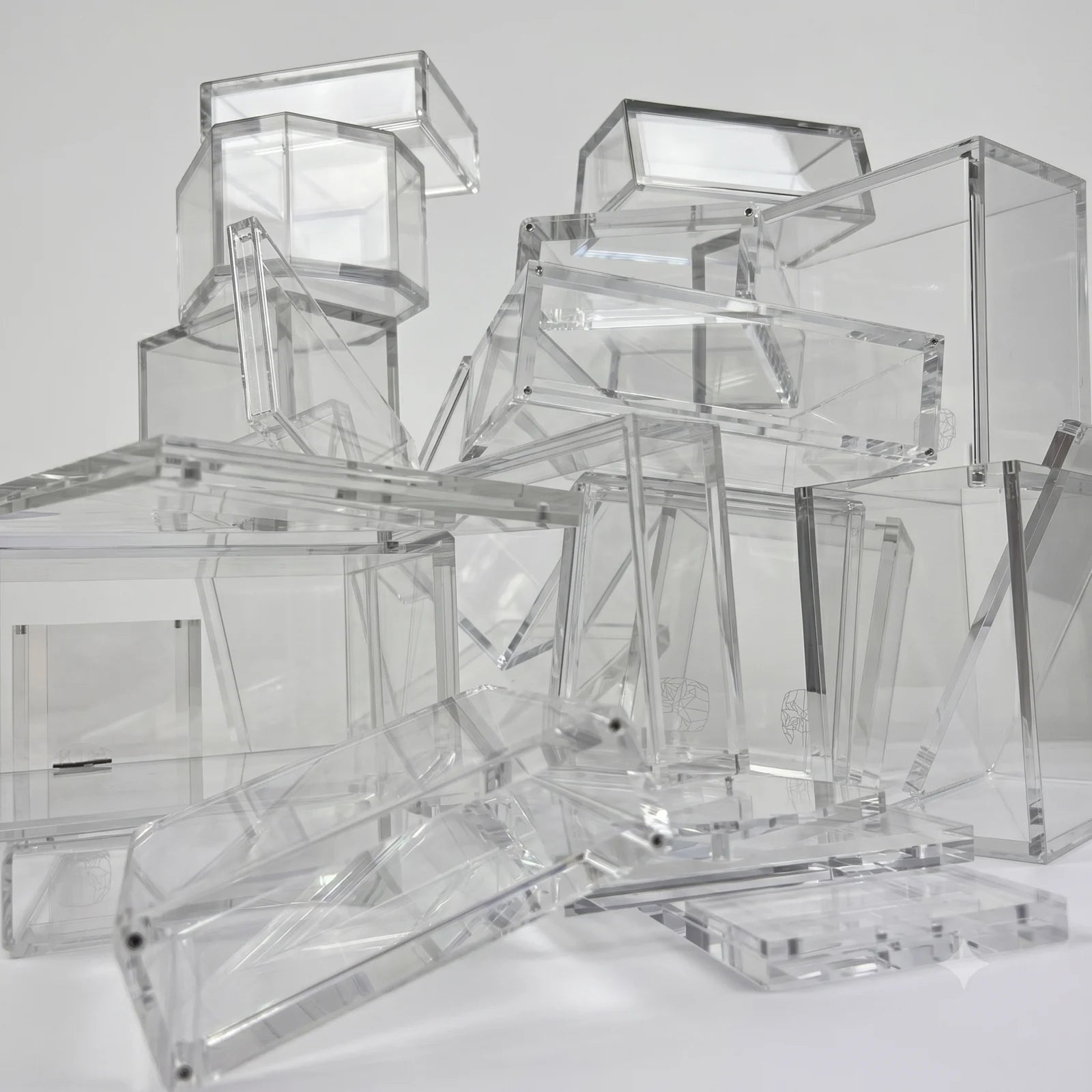 A pile of plain, empty acrylic displays of the kind the market offered before Phantom