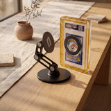 Magneto Desk Stand in Obsidian Black shown with Magneto display case holding a PSA graded Pokemon card, magnetic desktop display for collectors