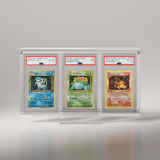 A front-facing shot of the Phantom Display Ultra slab case featuring three PSA-graded Pokémon cards, showcasing iconic cards like Charizard and their respective grades in a premium display setup. #authenticator_psa/cgc 