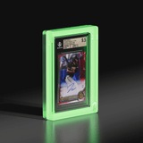 Angled view of a Phantom Display glow-in-the-dark slab case containing a 2022 Bowman Chrome Prospect Autos James Wood Red Lava Refractor card, graded 9.5 by Beckett, glowing with an ethereal ghost-like light. #authenticator_bgs