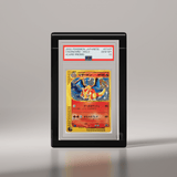 A PSA-graded vintage trading card of a charizard japanese pokemon card, shown upright in its protective slab case on a sleek black color phantom display stand. #color_black