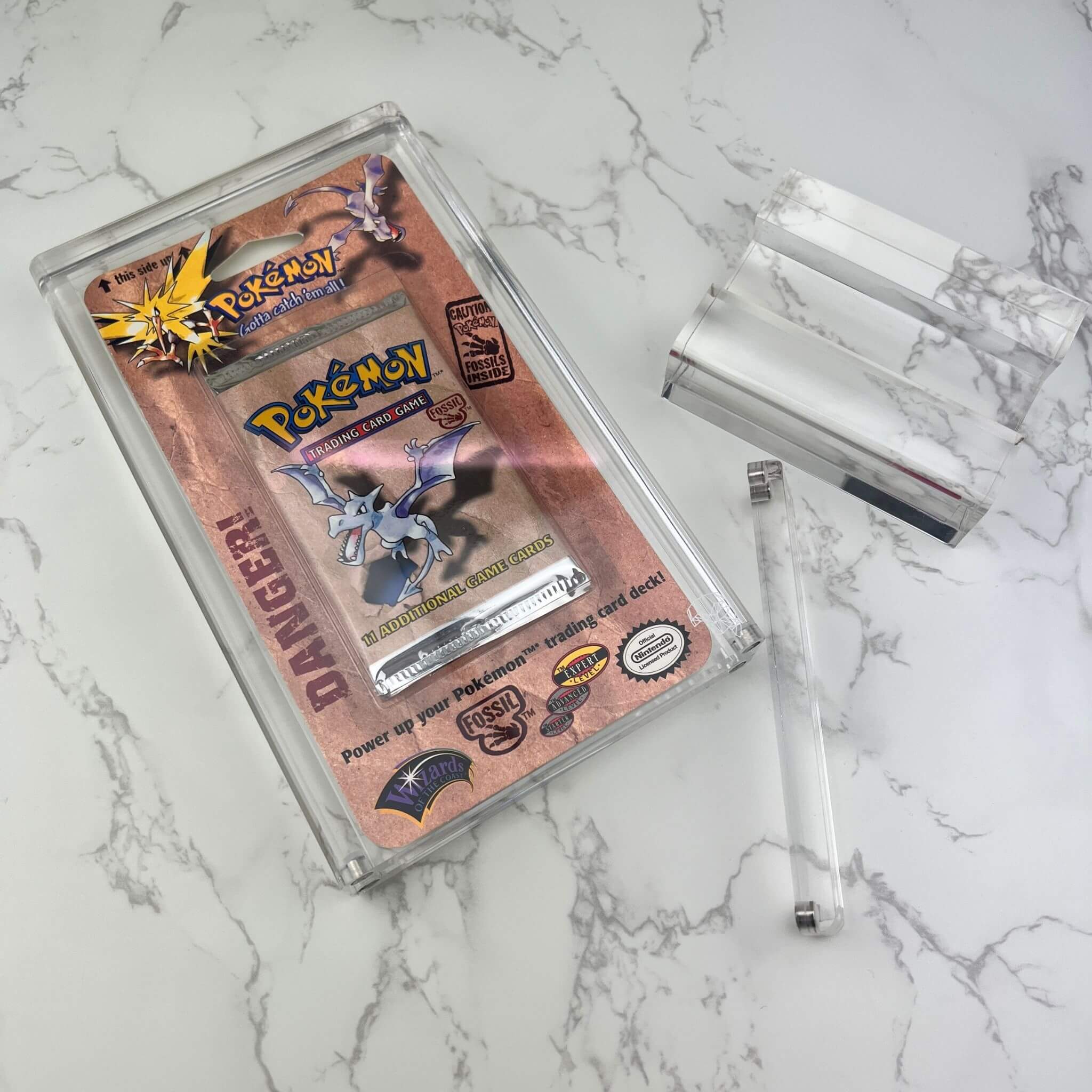 Quad Pokemon Blister Pack Magnetic Acrylic Protective Case With Stand On Table