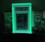 1999 Pokémon Game Gyarados card in a glowing Phantom acrylic display, offering premium protection and UV light enhancement.