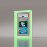 Angled view of PSA graded Blastoise 1996 Japanese Basic card in a Phantom Display neon green acrylic case. #size_psa