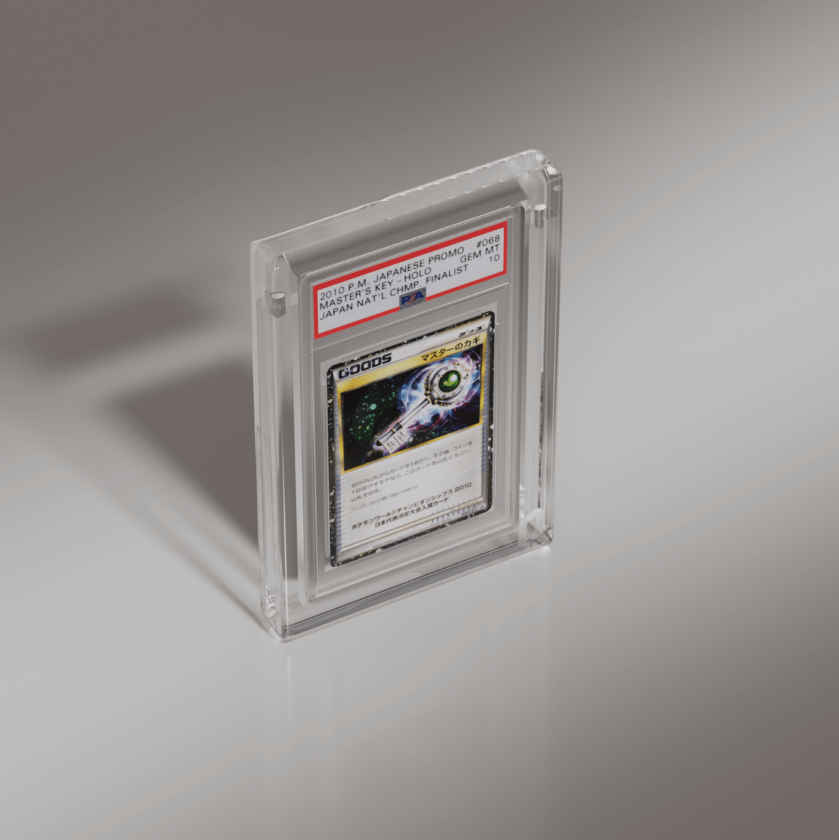 Close view of Phantom Display graded card case holding a 2010 P.M. Japanese promo Master's Key GEM MT 10, designed for clarity and protection for graded slabs. #authenticator_psa/cgc