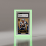 CGC graded Tom Brady 2012 Topps Supreme card displayed in a Phantom Display neon green acrylic case. #authenticator_psa/cgc