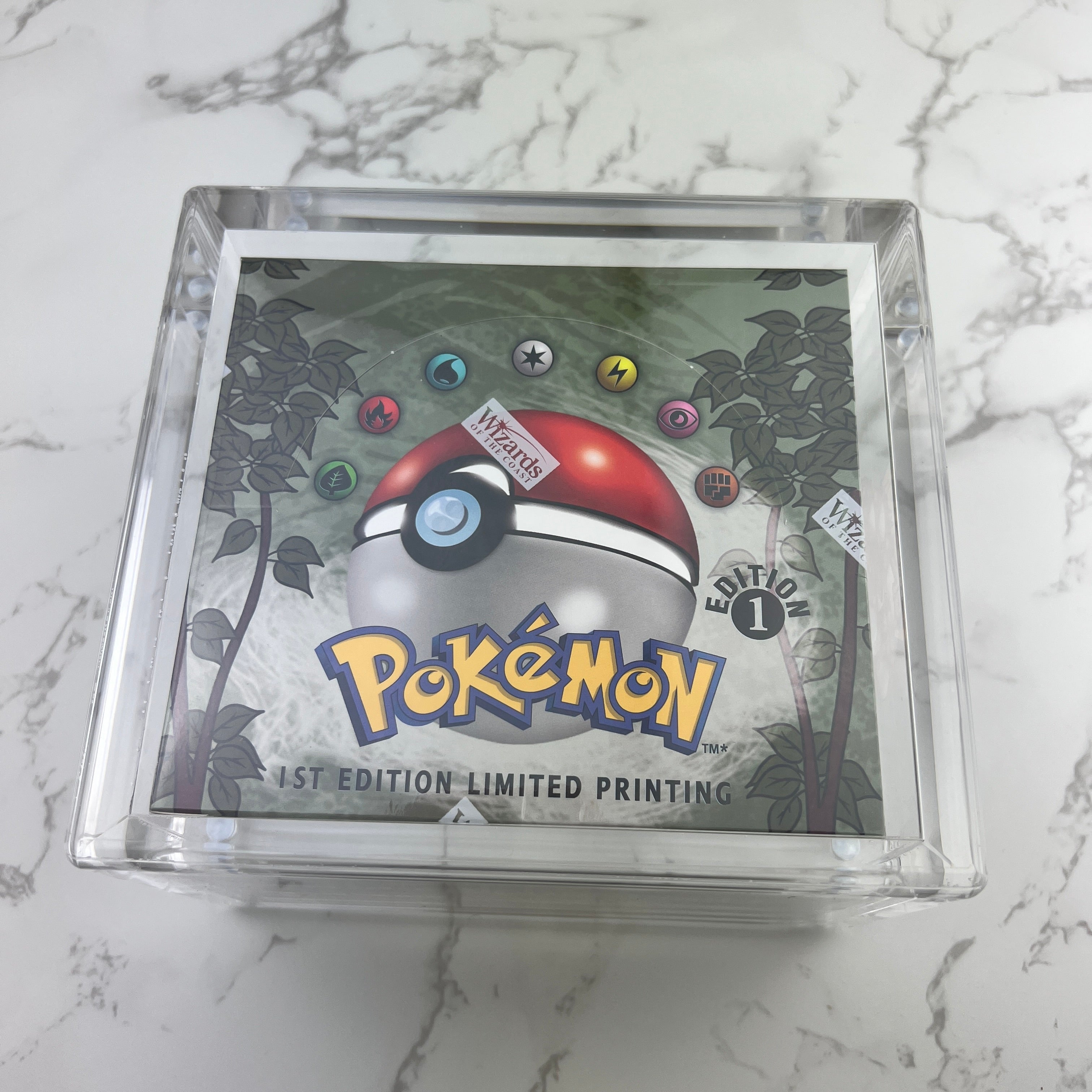 Pokemon booster box magnetic acrylic protective case. Crystal clear acrylic, with UV resistance. Fits: Base Set, Gym, Neo Genesis and Legendary Collection booster boxes.