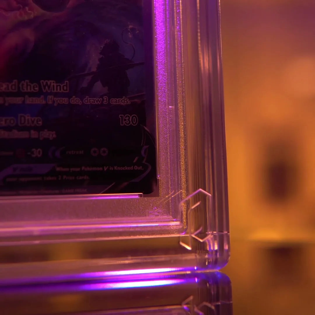 A graded card sealed in a Phantom Magneto crystal acrylic display